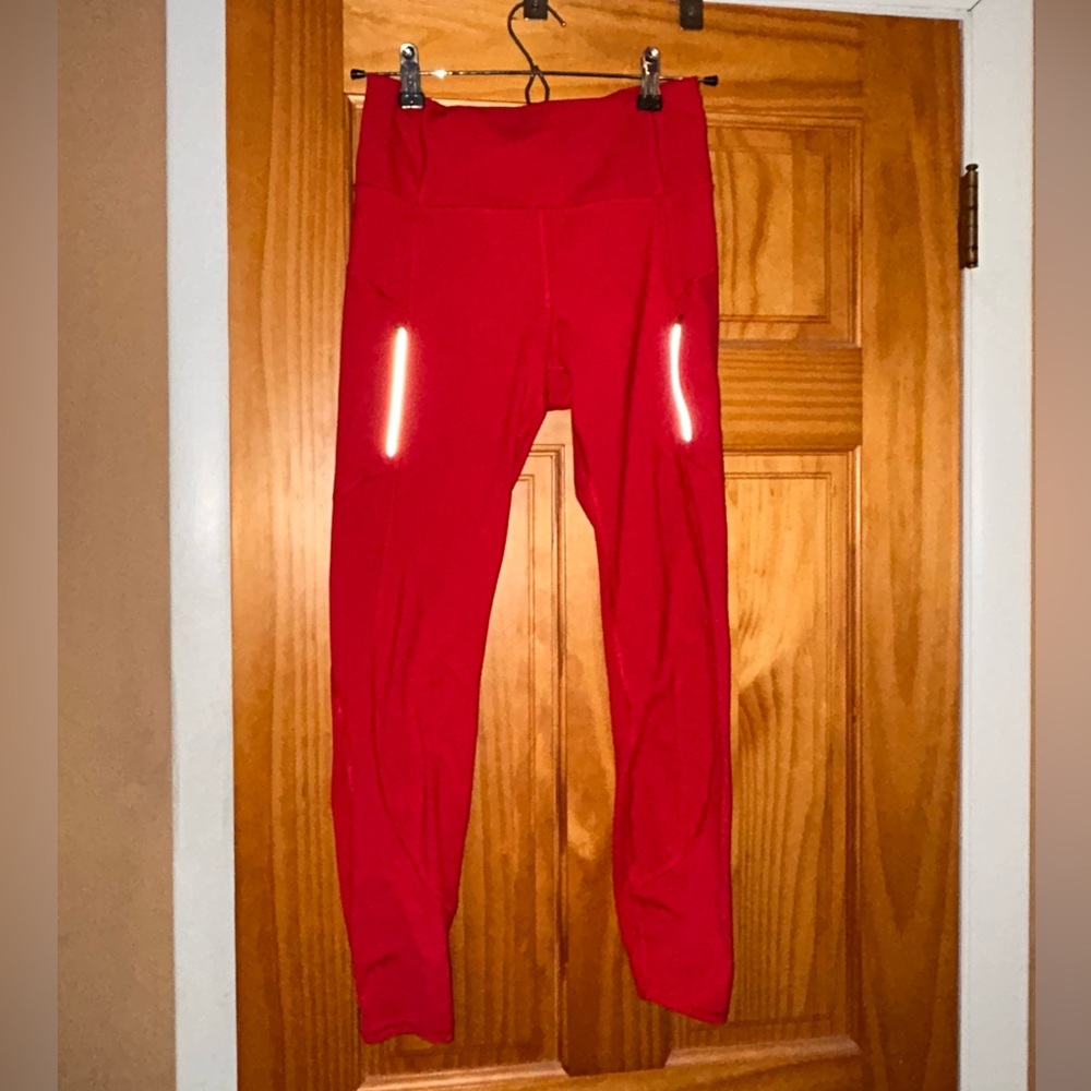 Athleta Red Rainier lined leggings w/ pockets and reflectors. Size small.